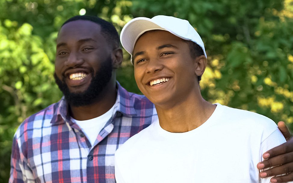 father supporting teen son with advice new chapter